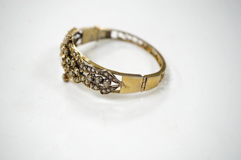 An Indian? gilt white metal and flat and rose cut diamond cluster set hinged bracelet. Condition - poor to fair